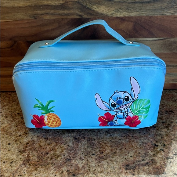Disney Handbags - Disney Blue Cosmetic Bag with Stitch Design new